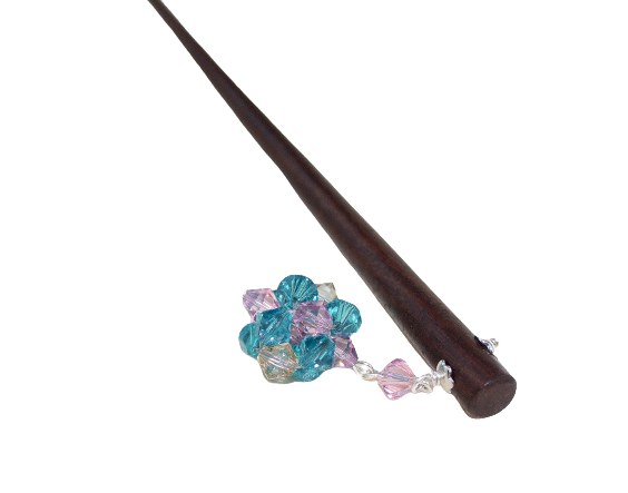 A handmade hairpin designed on pure teak wood with a handwoven crystal drop