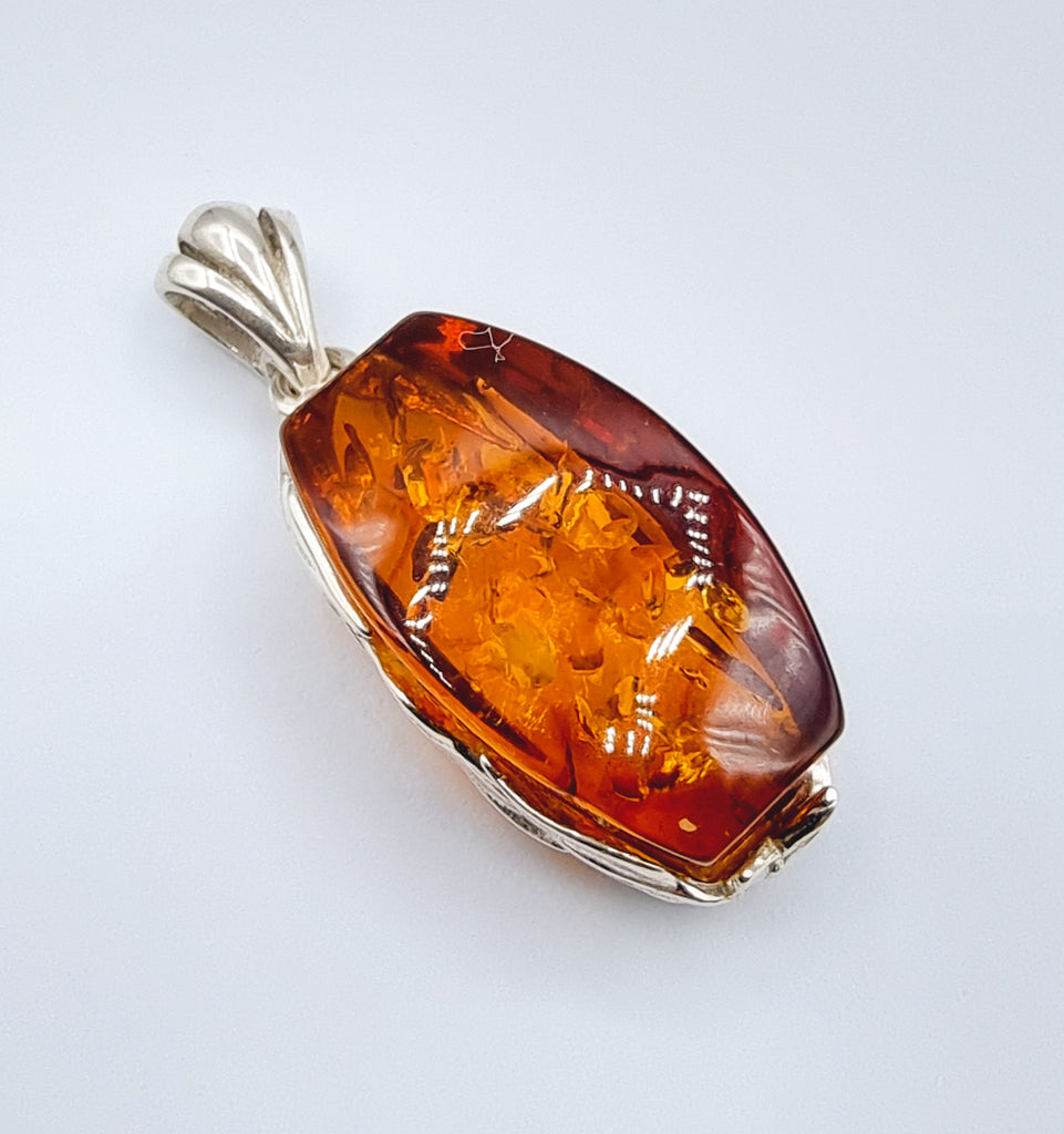 Natural cognac Baltic Amber, rectangular shape, vine bezel, set on Sterling Silver