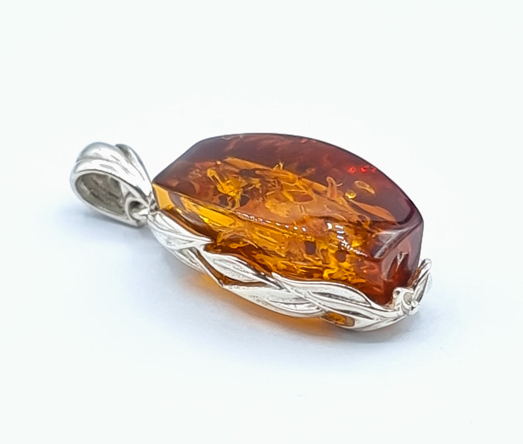 Natural cognac Baltic Amber, rectangular shape, vine bezel, set on Sterling Silver