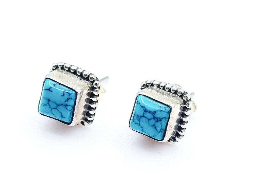 A pair of ear studs with beautiful square Turquoise cabochon, set on Sterling Silver. Origin India