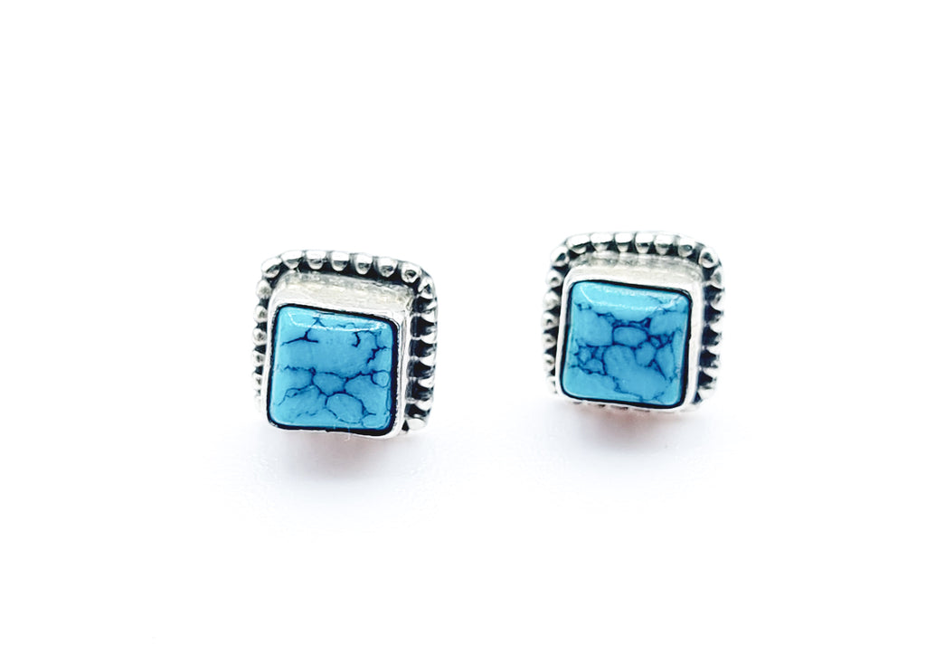 A pair of ear studs with beautiful square Turquoise cabochon, set on Sterling Silver. Origin India