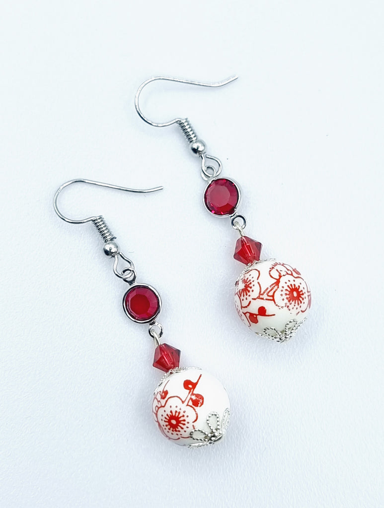 A pair of charming red and white porcelain drop earrings, handmade with a combination of red high grade imitation crystals.