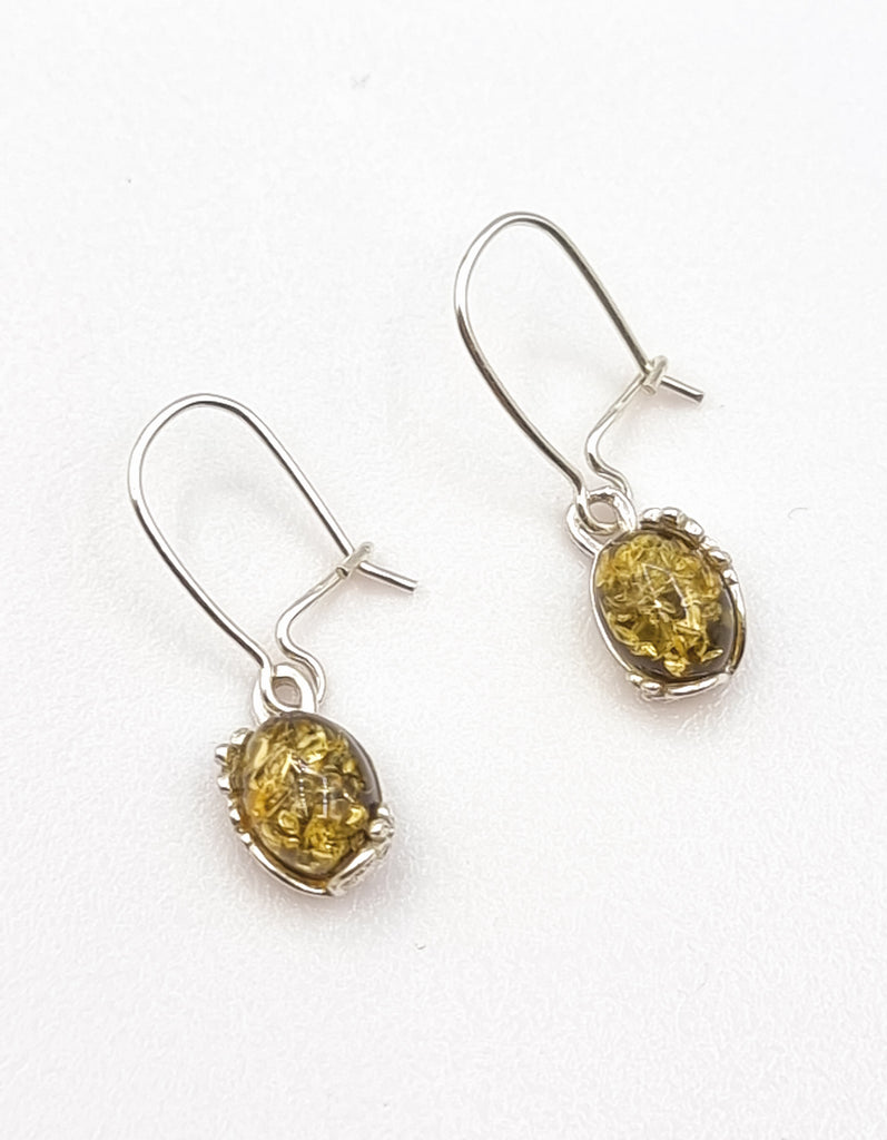 A pair of exquisite drop earrings, crafted from 925 Sterling Silver and featuring luxurious, natural Baltic Amber stones. Set on 925 Sterling Silver kidney hooks, the Amber stones are beautifully exposed. Origin Poland