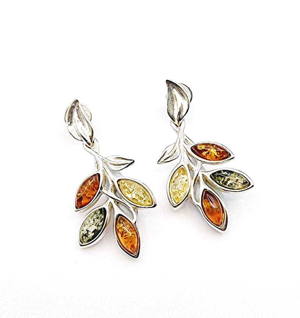 Shaped like a beautiful vine drop, these pair of captivating dangling earrings are crafted on 925 sterling silver with natural Baltic Amber in shades of cognac, light yellow and green. Origin Poland