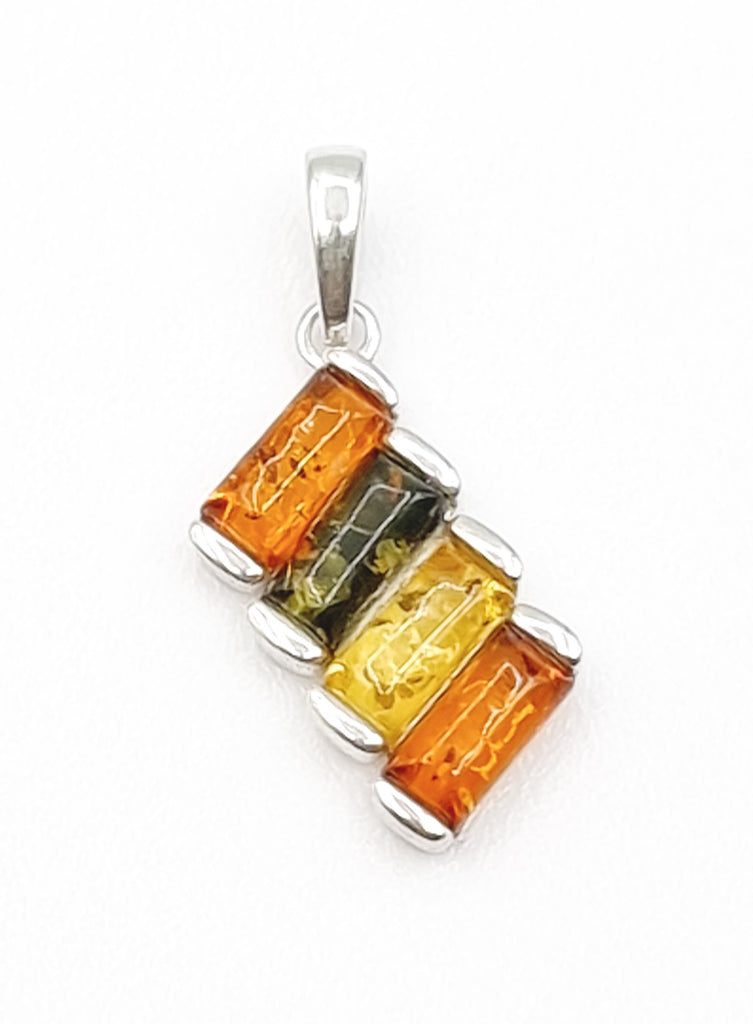 A modern take on classic elegance, this four tone Baltic Amber pendant is a stunning accessory crafted on sterling silver, with beautiful natural gems in hues of cognac, light yellow and green. With its ethereal beauty, this pendant is a luxurious expression of art and fashion. Origin Poland