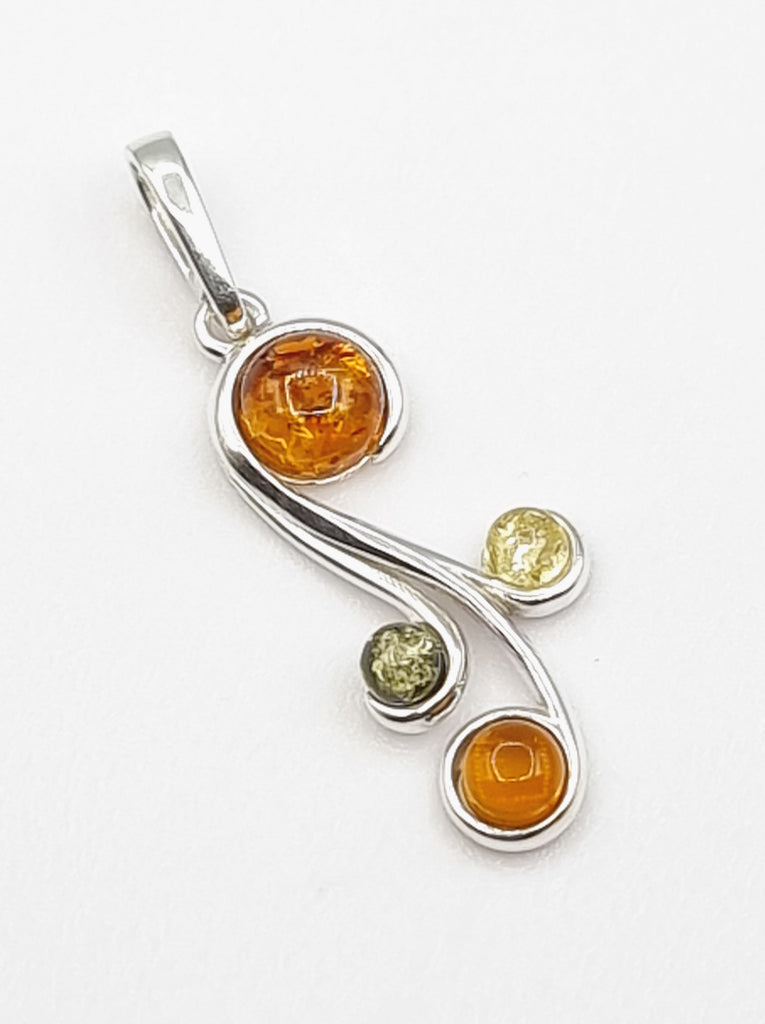 An elegant pendant, crafted with natural Baltic Amber on 925 Sterling Silver. A sophisticated design, created with 3 tones of beautiful Amber, in hues of green, light yellow and cognac. With a modern swirl pattern, this pendant will look truly gorgeous as a necklace. Perfect for women. Origin Poland