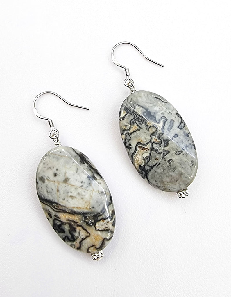 A pair of stunning Grey Lace Agate drop earrings, that is sure to draw attention! Handmade with a careful selection of natural gemstones, making each piece unique and exquisite, and designed on simple sterling silver hooks, maintaining the focus on the beautiful gems. Truly a gorgeous gift of nature!