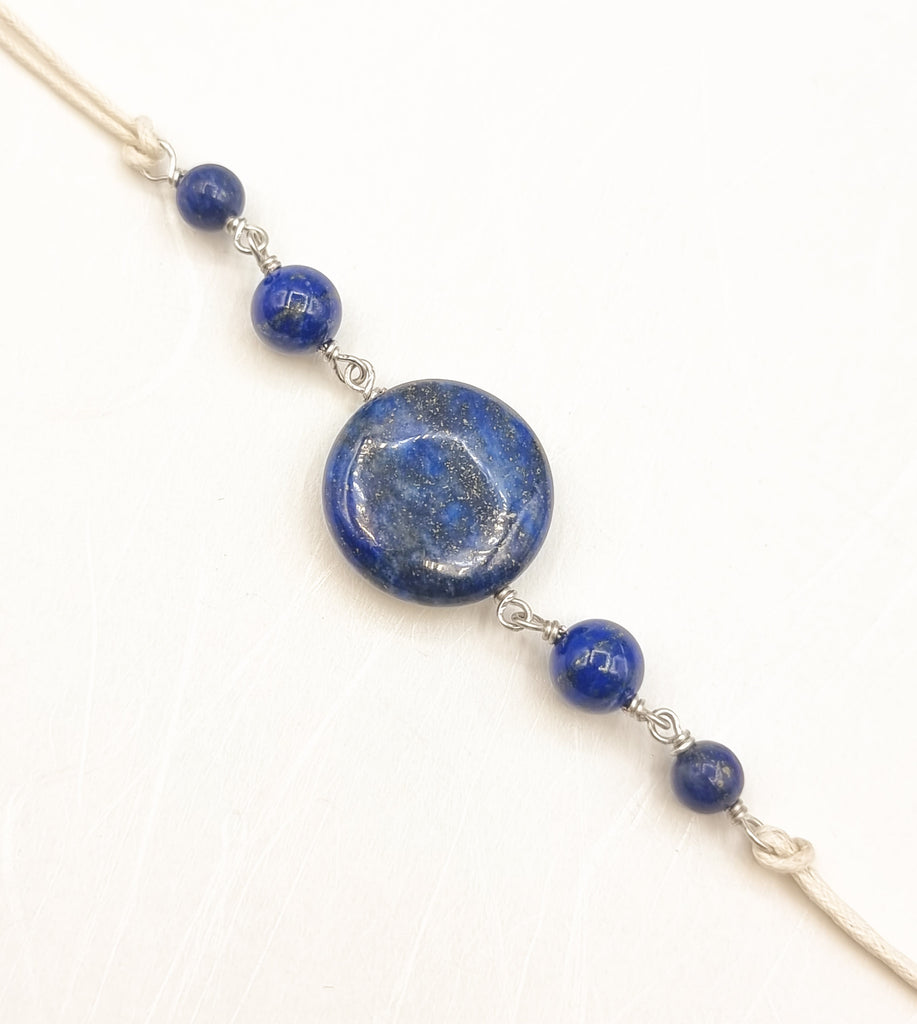 A handmade Rakhi delicately crafted with gorgeous natural Lapis Lazuli gemstones, that has been prized for its beauty and metaphysical properties for centuries. Truly unique and one-of-a-kind!