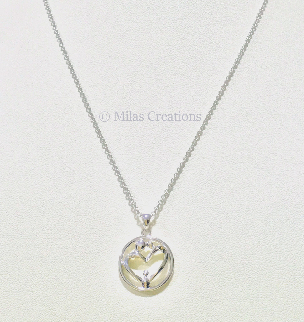 A beautiful Rhodium Plated Sterling Silver Necklace depicting a loving family. A beautiful gift for a loving mother