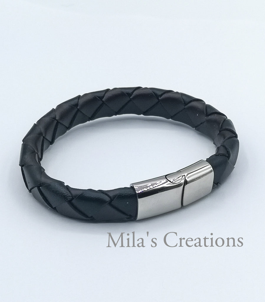 A blend of black and dark chocolate braided leather bracelet with a stainless steel magnetic clasp