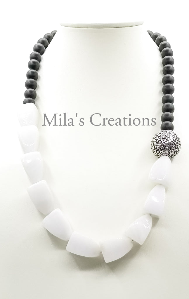 A beautiful depiction of Yin and Yang.  A Matinee length Necklace designed with a combination of Snow Quartz and matt finish Onyx with a gorgeous German Silver accent bead. A truly one of a kind piece!