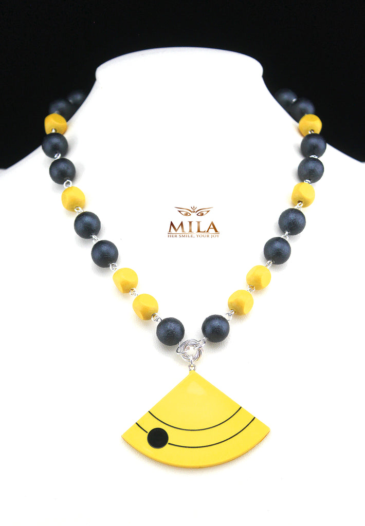 'Bumblebee' A subtle combination of yellow and grey wooden beads with an acrylic yellow accent, makes this choker length necklace a one of a kind piece. 