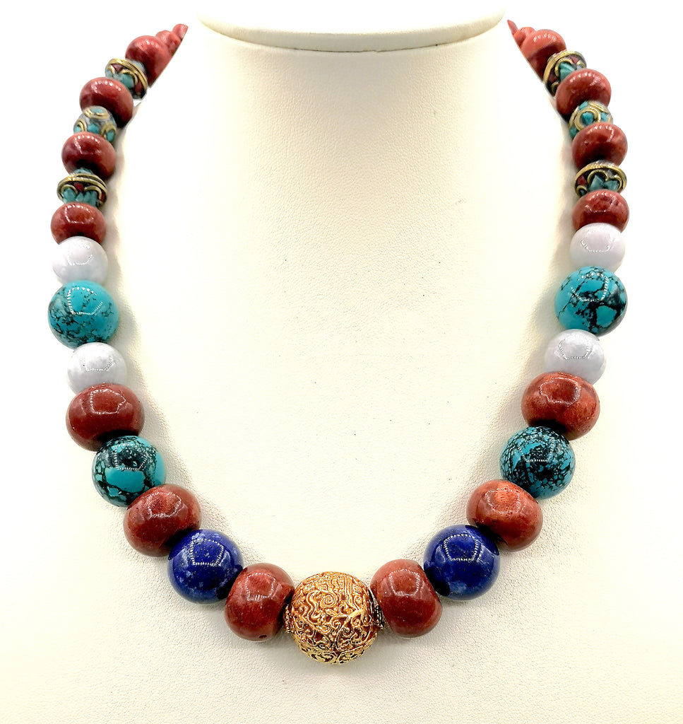 The vibrant colours of Sponge Coral and Lapis Lazuli with soft shades of Jade adds a gorgeous hue to this handmade Matinee length necklace