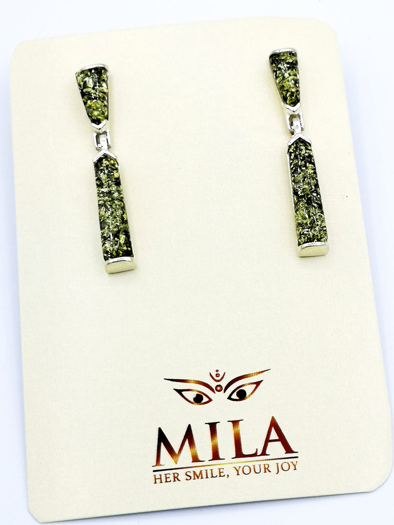 Gorgeous pair of Baltic Amber dangling earrings, set on Sterling Silver. The very light yellow Amber accentuated with a layer of black resin at the back, adds a green tone to the Amber. Origin - Lithuania