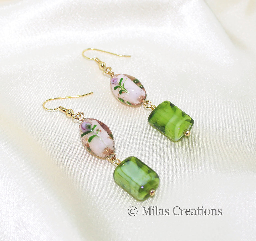 A pair of beautiful hand blown glass bead dangling earrings. A combination of pastel shades adds a charm to these earrings