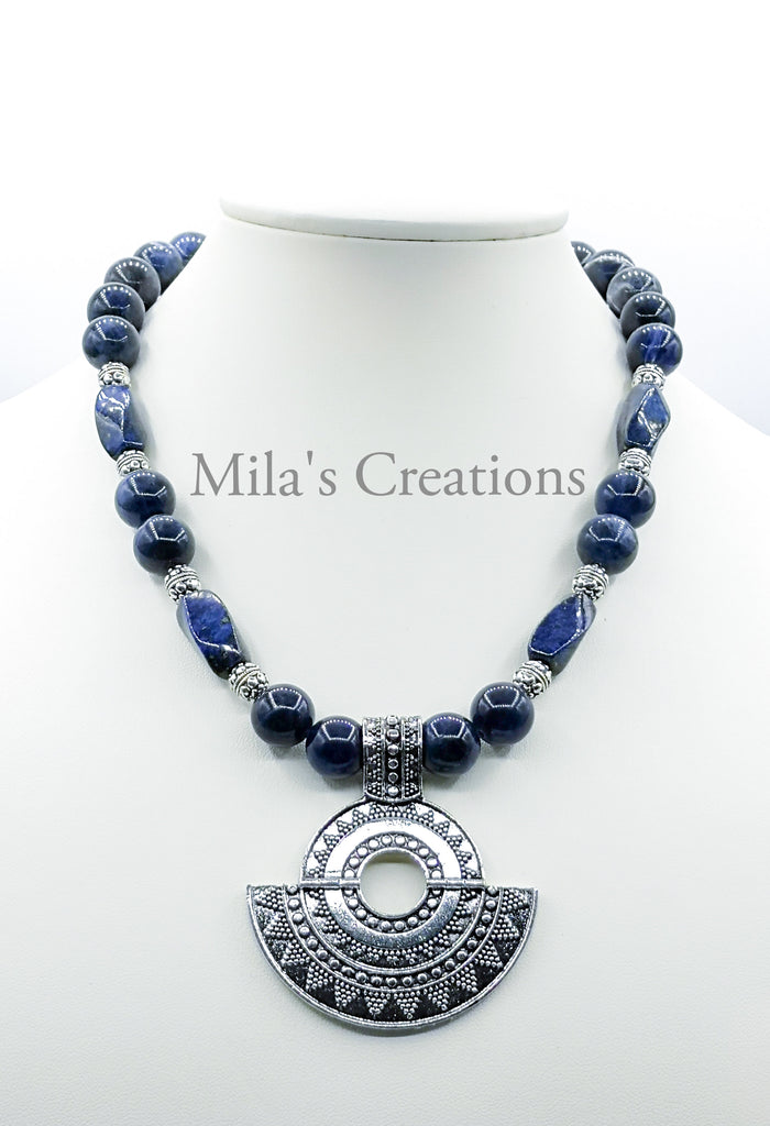 An exquisite Choker length Necklace designed and handmade with a blend of Sodalite and Lapis Lazuli, with a beautiful German Silver Pendant. 