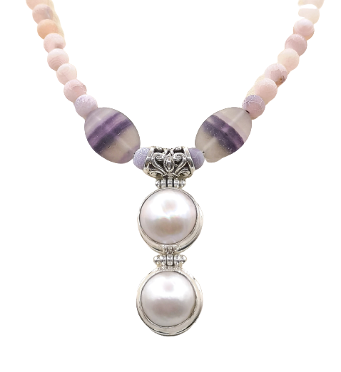 A beautiful choker length handmade necklace on Fluorite with a Sterling Silver pendant set with Freshwater Pearl