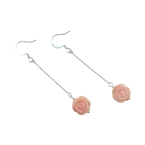 A pair of one of a kind carved Natural Pink Coral Roses designed and handmade into dangling earrings on Sterling Silver