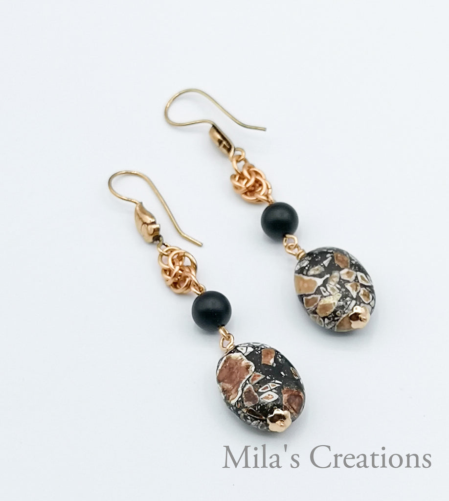 A pair of handmade earrings designed with Compressed Minerals and Matt Onyx with a Copper byzantine section, makes these earrings not just classy, but also one of a kind.